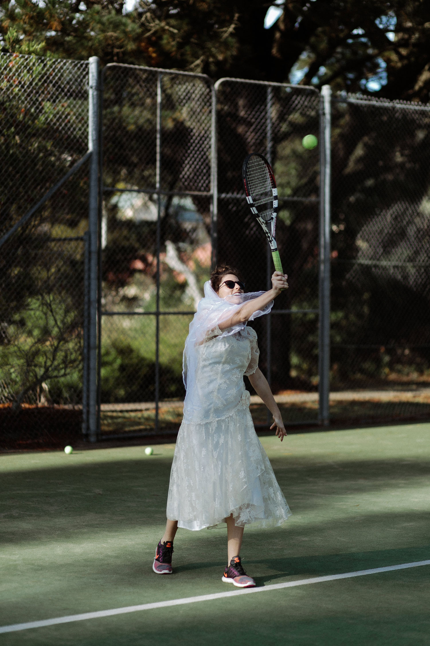 bride vintage wedding dress playing tennis