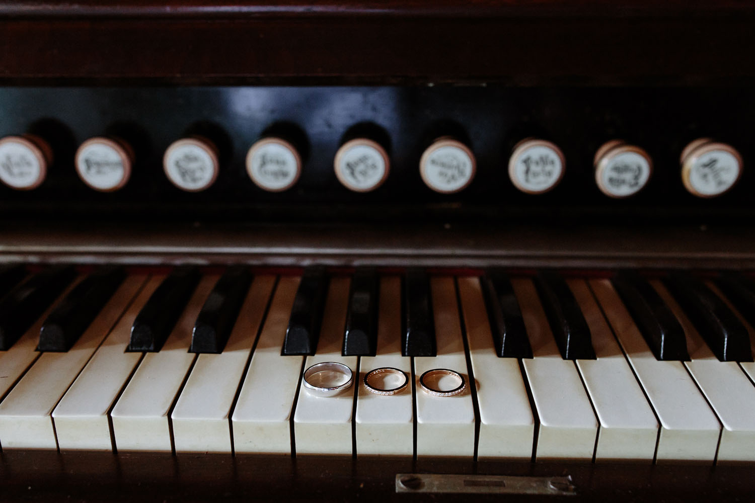 wedding rings on piano keys