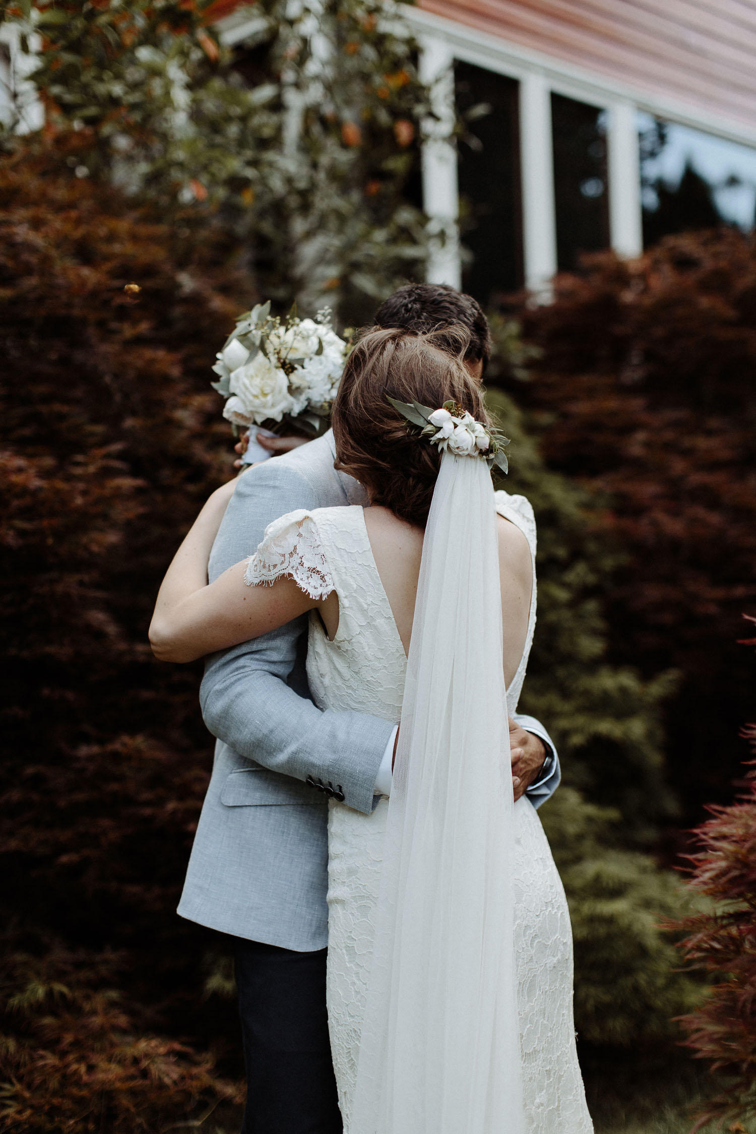 bride groom hugging autumn leaves