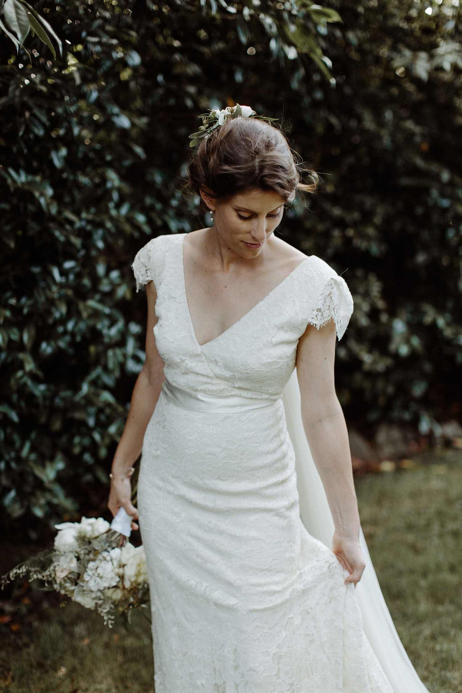 bride portrait holding dress