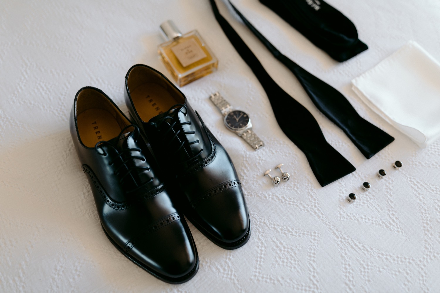 collection of stylish black tie groom details