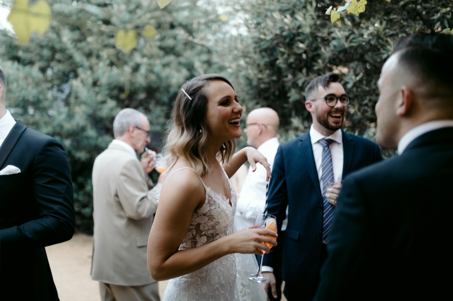 bride laughing during cocktail hour
