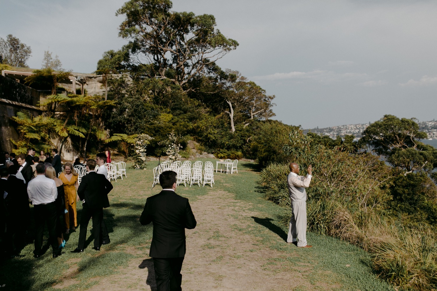 wedding guest taking photo of sydney harbour