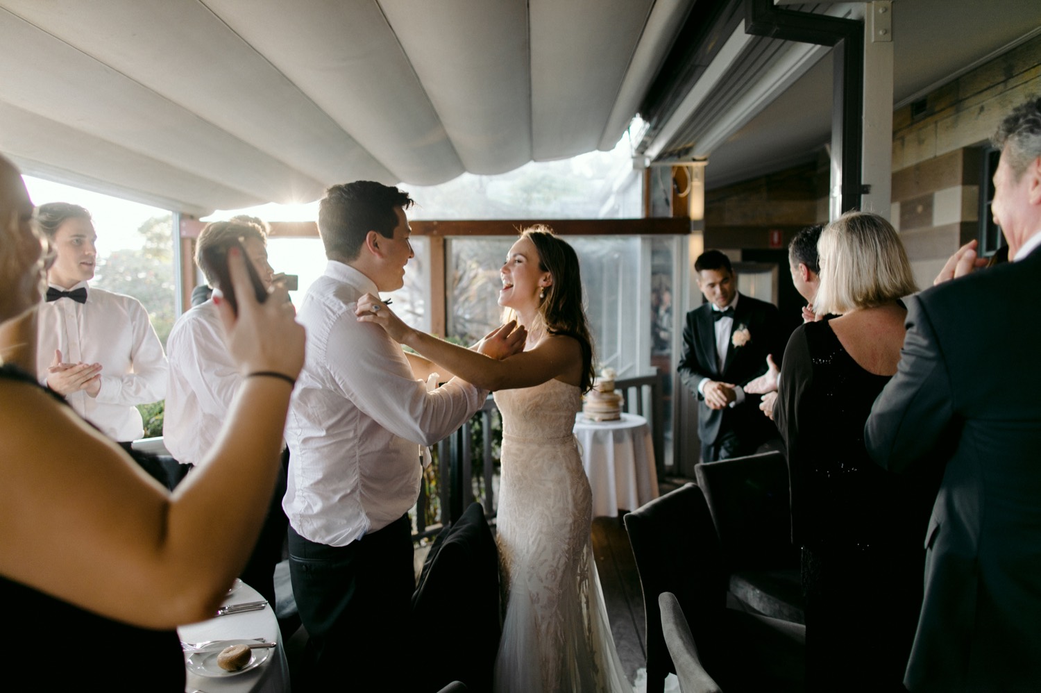 bride and groom entering reception celebration