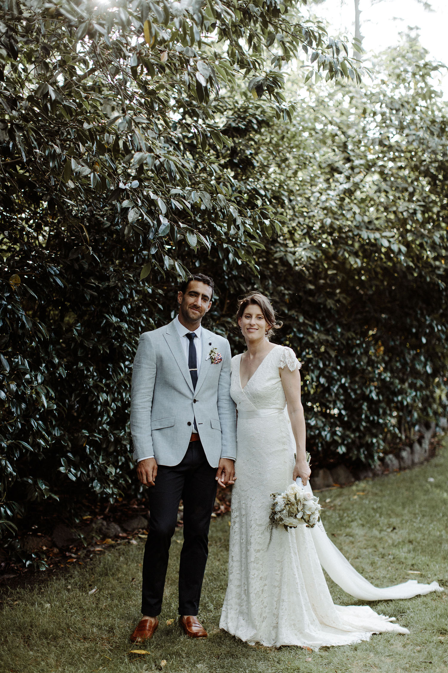 bride and groom smiling at camera