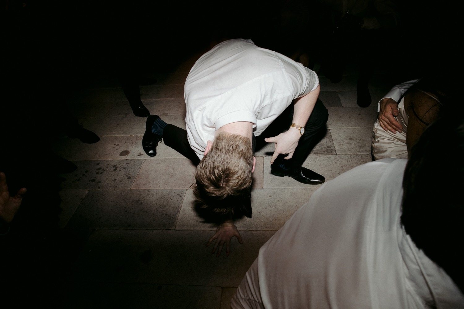 man slamming the ground on dancefloor